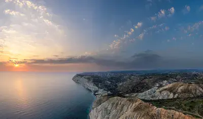 Sunset near cape Aspro cliffs aerial panorama from drone, Limassol, Cyprus