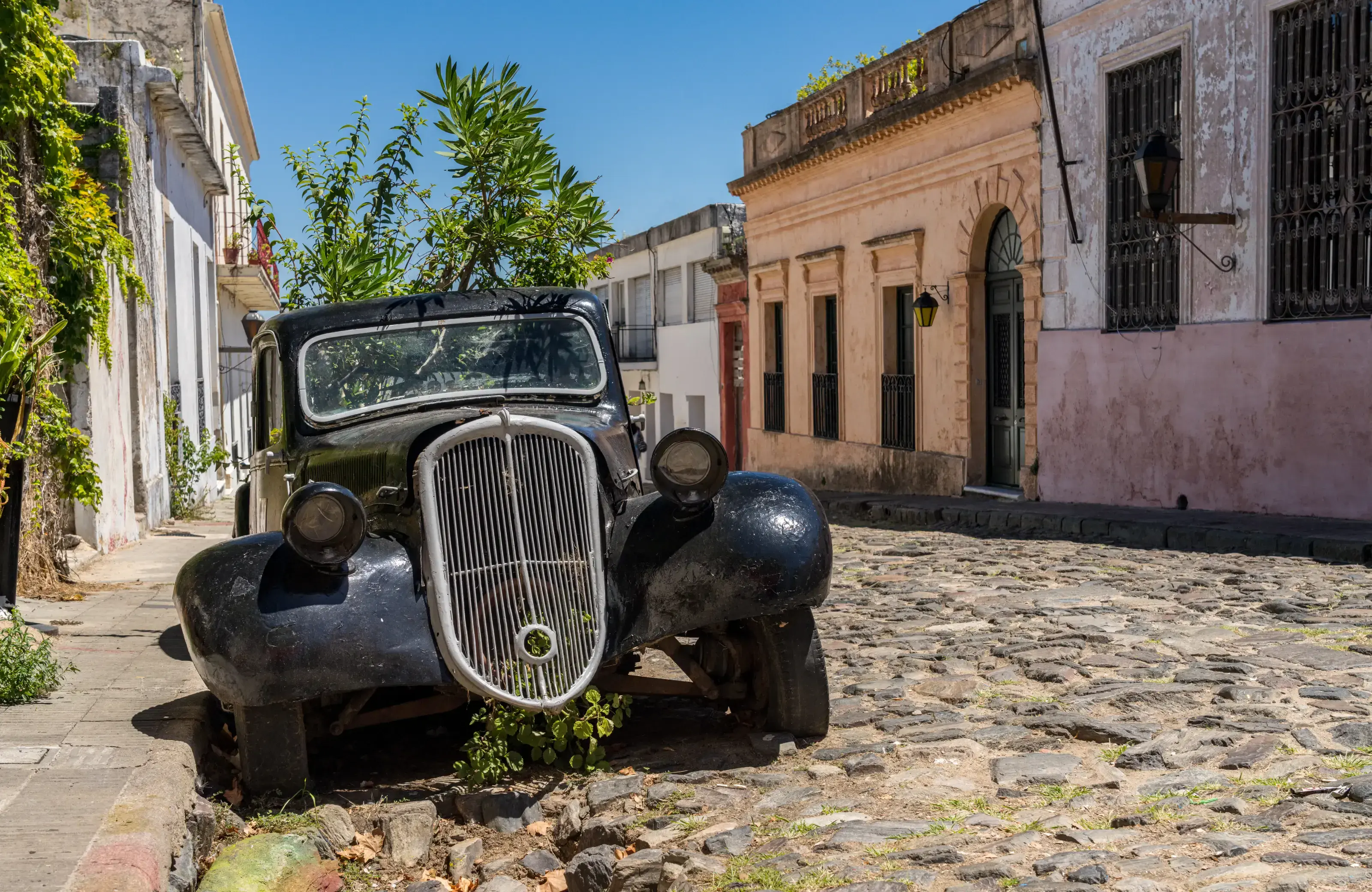 Old antique car in cobbled street of Colonia del Sacramento in Uruguay. Old car in historical town of Colonia del Sacramento