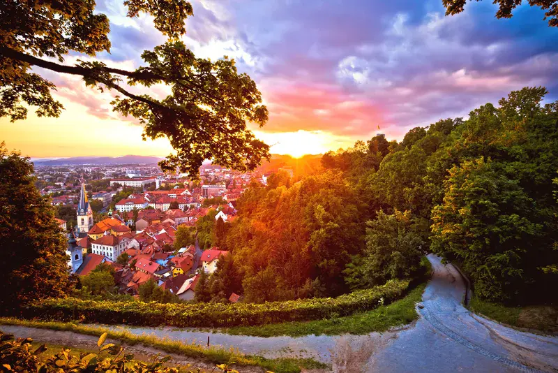 Ljubljana aerial rooftops view at red sunset, capital of Slovenia