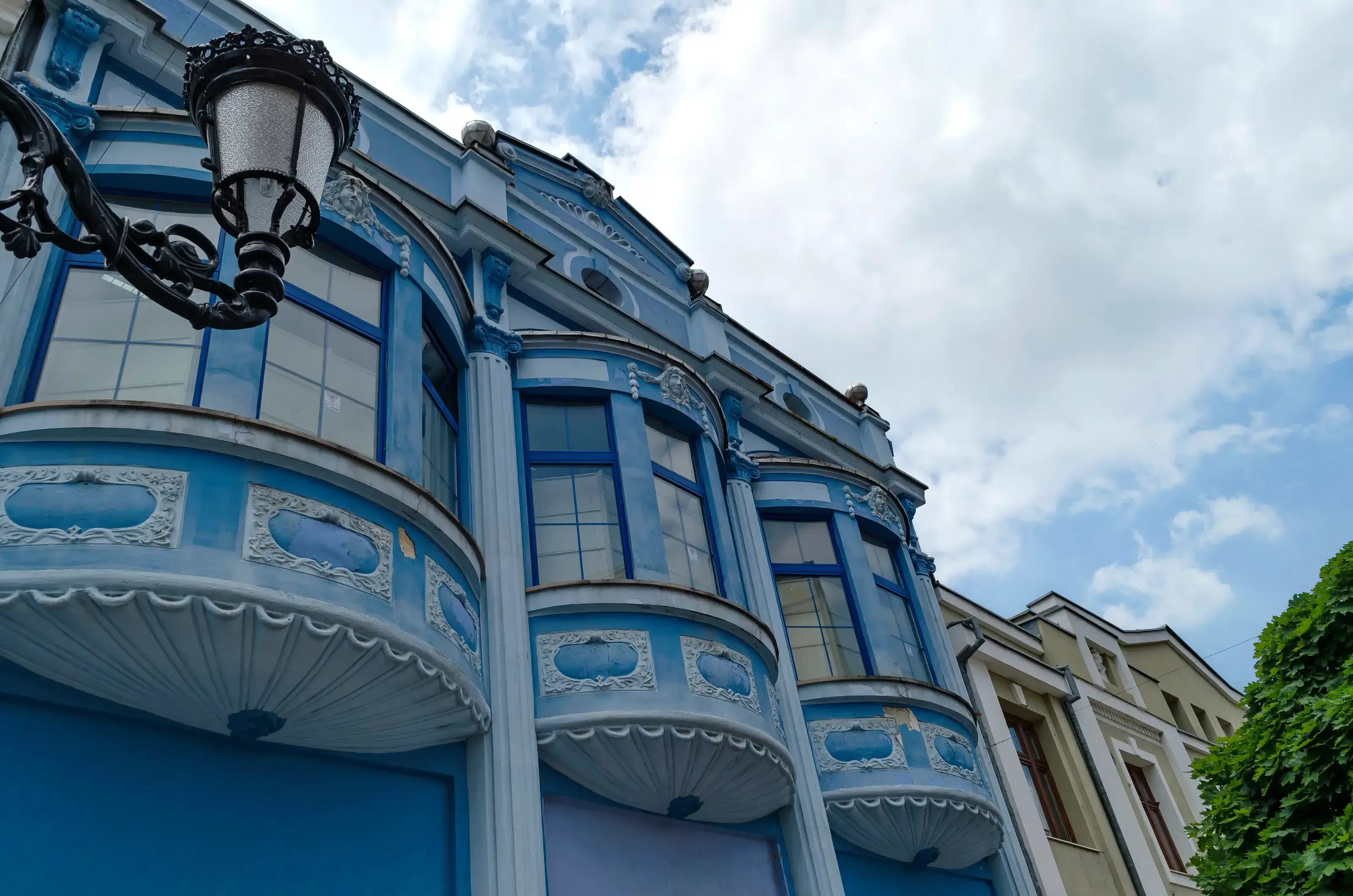 Fragment of old house with bow-window and plaster ornament. Plovdiv town, Bulgaria
