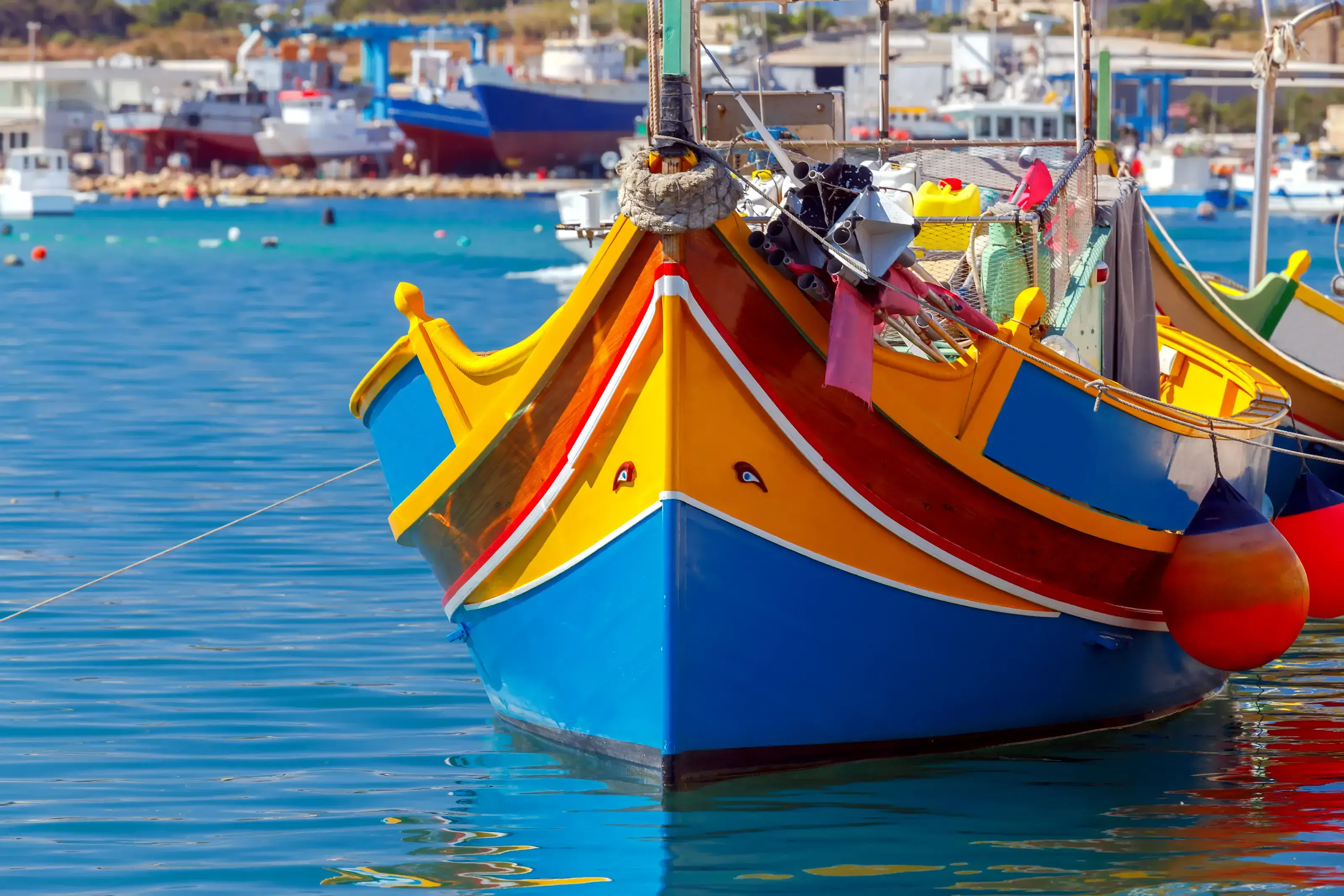 Malta. Marsaxlokk. Traditional fishing boats.. Traditional multicolored fishing boats Luzzi in the harbor Marsaxlokk. Malta.
