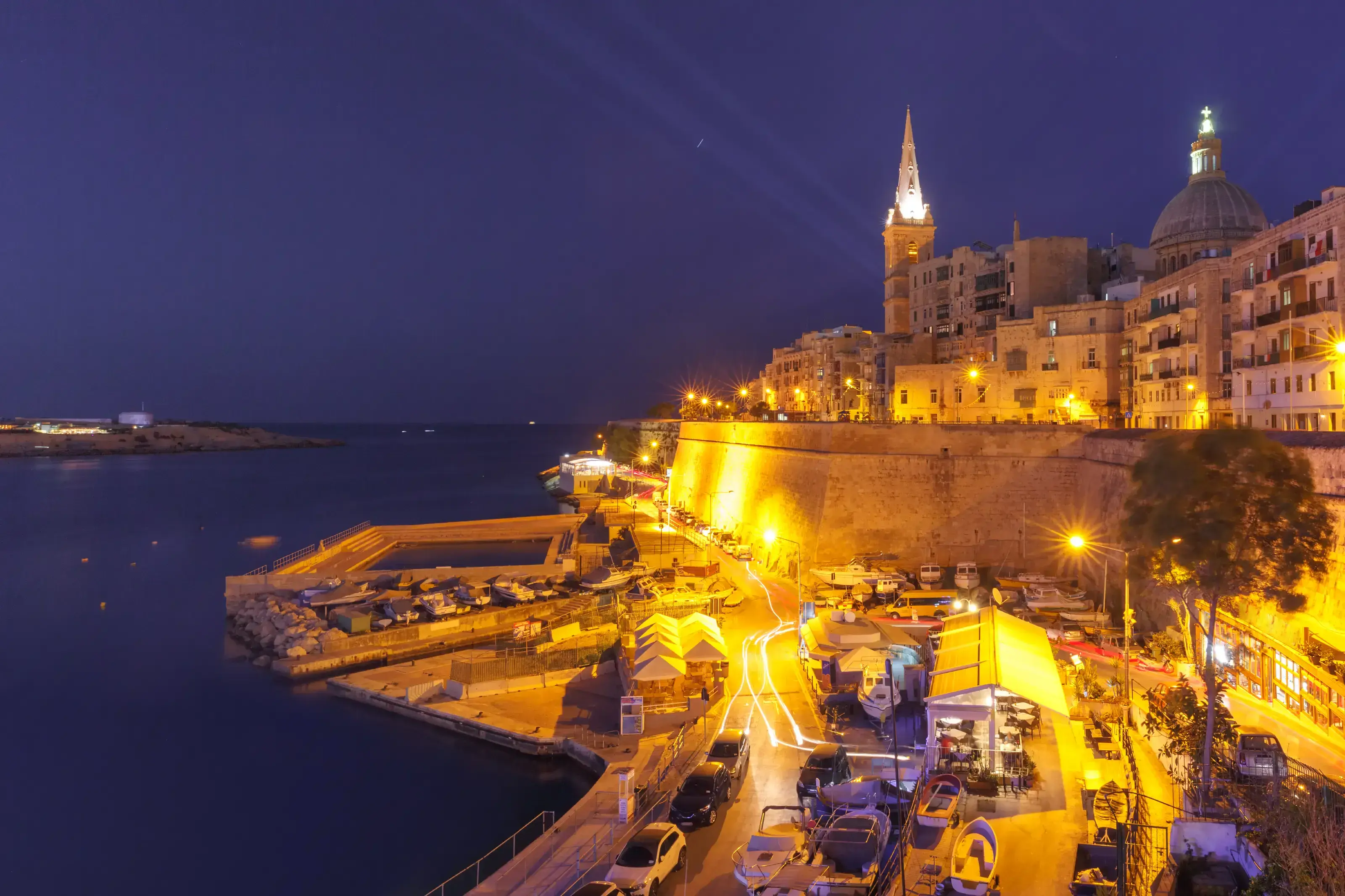 Valletta Skyline at dark night, Malta. Valletta Skyline with church of Our Lady of Mount Carmel and St. Paul&rsquo;s Anglican Pro-Cathedral, at dark night, Valletta, Capital city of Malta